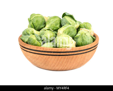 Wooden bowl full of fresh brussel sprouts on a white background Stock Photo