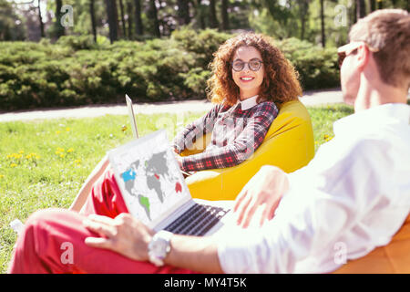 Cheerful students working on their projects Stock Photo