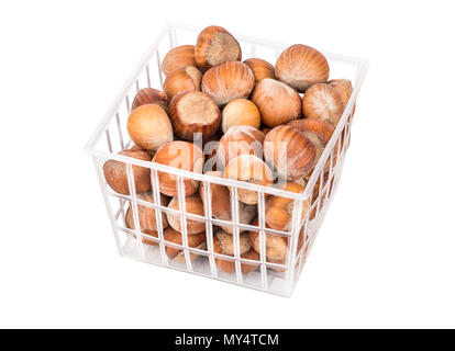 Hazelnuts in shell and the transparent container on a white background Stock Photo
