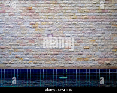 Bright Brick Wall Texture on Swimming Pool Stock Photo