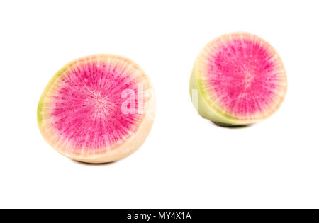 Two halves of watermelon radishes on a white background Stock Photo