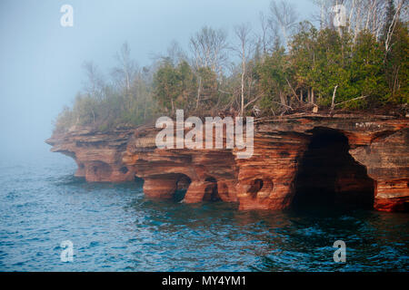 Devil's Island caves with fog on Lake Superior and the Apostle Islands National Lakeshore, Bayfield, Wisconsin, USA Stock Photo