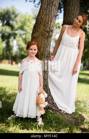 red-haired woman with a teddy bear Stock Photo - Alamy