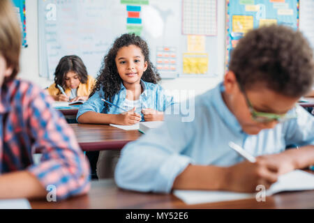 beautiful african american girl sitting in class Stock Photo