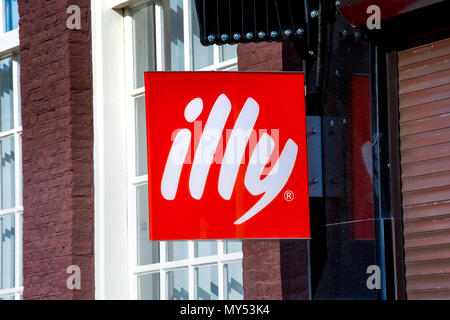 Illy logo sign on the wall. Illy is italian coffee roasting company that specializes in the production of espresso. Stock Photo