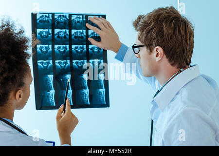 two young doctors examining an x-ray photograph Stock Photo