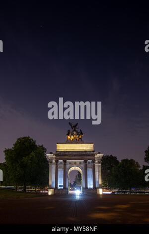 London, England, UK - June 1, 2018: The triumphal Wellington Arch at the head of Constitution Hill on Hyde Park Corner in London is lit up at night.