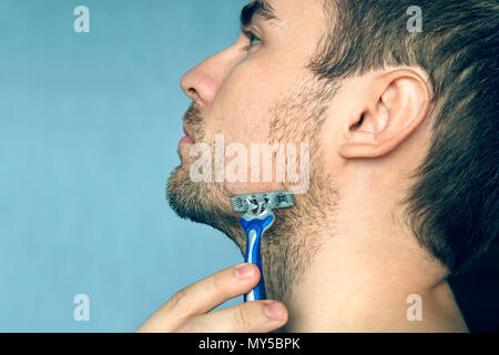 Removing ingrown hair with tweezer after shaving legs Stock Photo - Alamy