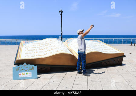 Beirut Lebanon. 6th June 2018. A large opened Qoran book on the Beirut corniche seafront  to celebrate the Islamic holy month of Ramadan which ends on 15th June. Ramdan traditionally falls on the ninth month of the Islamic calendar, and is observed by Muslims worldwide as a month of fasting (Sawm) to commemorate the first revelation of the Quran to the prophet Muhammad Credit: amer ghazzal/Alamy Live News Stock Photo
