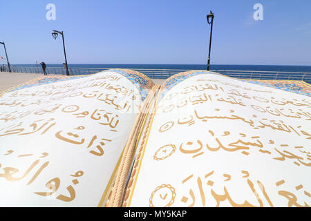 Beirut Lebanon. 6th June 2018. A large opened Qoran book on the Beirut corniche seafront  to celebrate the Islamic holy month of Ramadan which ends on 15th June. Ramdan traditionally falls on the ninth month of the Islamic calendar, and is observed by Muslims worldwide as a month of fasting (Sawm) to commemorate the first revelation of the Quran to the prophet Muhammad Credit: amer ghazzal/Alamy Live News Stock Photo