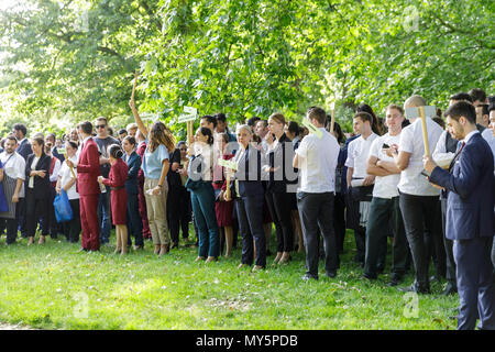 Knightsbridge, London, 6th June 2018. Hotel Staff from the Mandarin Oriental wait, in order of department, to receive briefings and updates. Firefighters, rescue services and the police tackle the aftermath of a large fire at the Mandarin Oriental hotel in Knightsbridge, involving around 120 firefighters in total. Credit: Imageplotter News and Sports/Alamy Live News Stock Photo