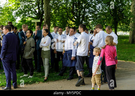 Knightsbridge, London, 6th June 2018. Hotel Staff from the Mandarin Oriental wait, in order of department, to receive briefings and updates. Firefighters, rescue services and the police tackle the aftermath of a large fire at the Mandarin Oriental hotel in Knightsbridge, involving around 120 firefighters in total. Credit: Imageplotter News and Sports/Alamy Live News Stock Photo