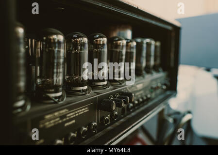 close-up shot of sound amplifier with lamps at recording studio Stock Photo