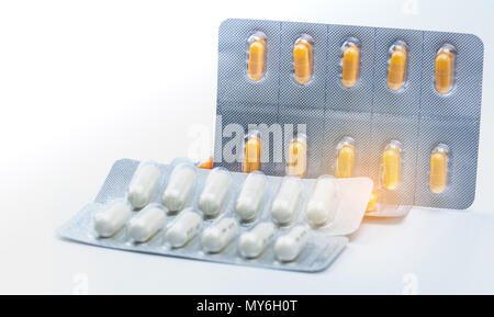 Cefixime and azithromycin capsule in blister pack for treatment gonorrhea. Neisseria Gonorrhoeae treatment. Antibiotic drug resistance. Orange and whi