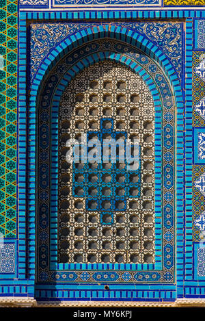 Colorful Islamic patterns, window covered with Arabic  screen, mosaic tiles. Dome of the Rock, Temple Mount mosque, Jerusalem, Israel Stock Photo