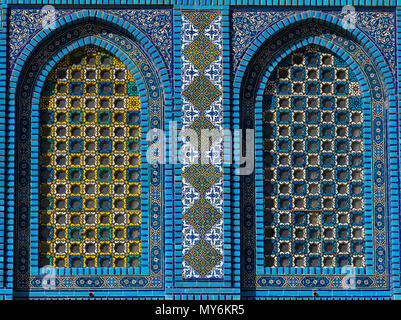 Colorful Islamic patterns, window covered with Arabic  screen, mosaic tiles. Dome of the Rock, Temple Mount mosque, Jerusalem, Israel Stock Photo