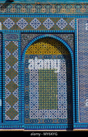 Colorful Islamic patterns, window covered with Arabic  screen, mosaic tiles. Dome of the Rock, Temple Mount mosque, Jerusalem, Israel Stock Photo