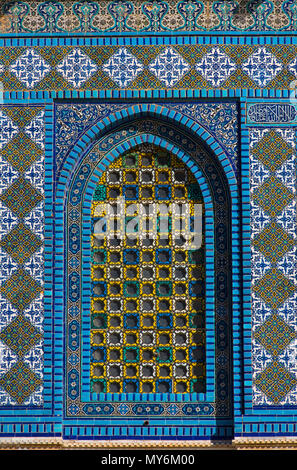 Colorful Islamic patterns, window covered with Arabic  screen, mosaic tiles. Dome of the Rock, Temple Mount mosque, Jerusalem, Israel Stock Photo