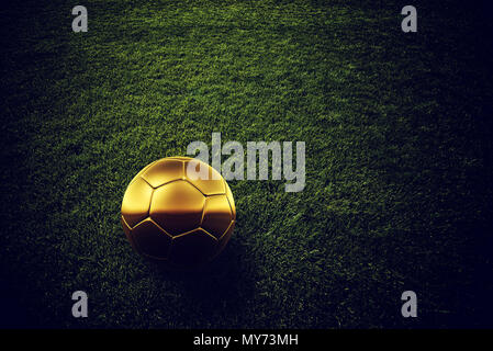 Golden soccer ball on football pitch grass, 3d rendering illustration Stock Photo