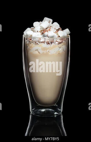 Double walled glass with coffee cocktail decorated with whipped cream and marshmallows isolated on black Stock Photo