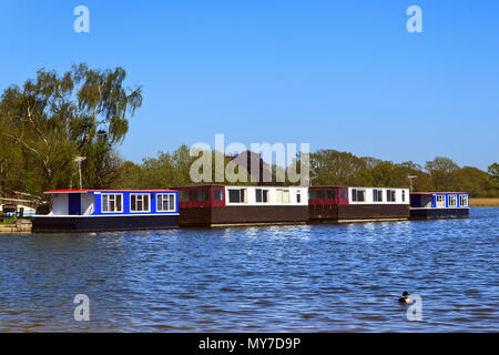 Houseboats moored on Hickling Broad on the Norfolk Broads, England UK Stock Photo