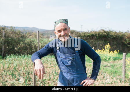 Man in vegetable garden Stock Photo