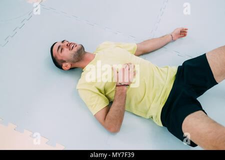 Exhausted man lying on the floor after a lively birthday party Stock ...