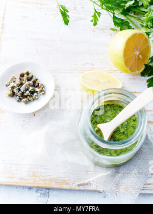 Salsa verde, capers, lemons Stock Photo