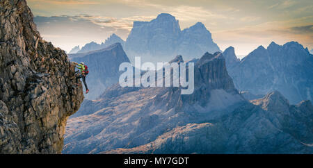 Climber on rocky wall, Dolomites, Cortina d'Ampezzo, Veneto, Italy Stock Photo