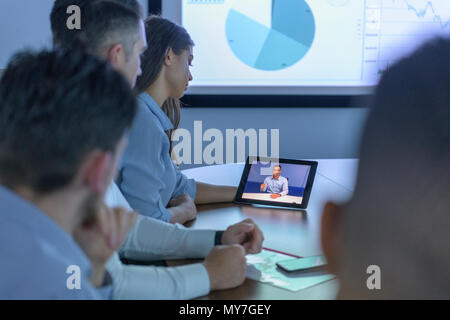 Business team with video conference with digital tablet during business meeting