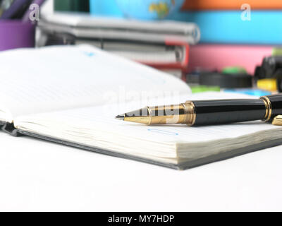 close up.diary and ball point pen on the background of school supplies Stock Photo