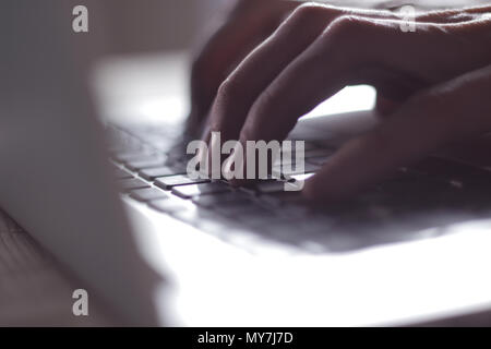 blurred image of male hand typing on laptop keyboard.close up Stock Photo