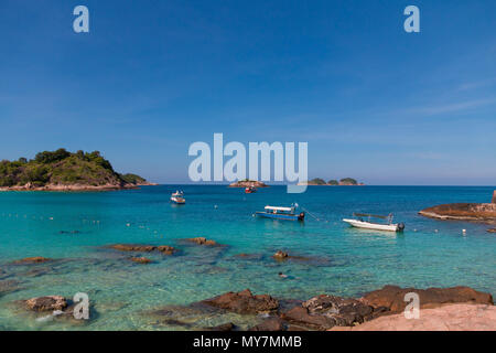 A nice view from the rocky part of Long Beach (Pasir Panjang) towards the South China Sea with the two islands, Pulau Paku Kecil and Pulau Lima. Stock Photo