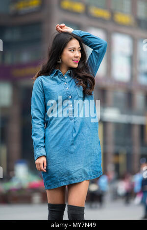 Picture of One beautiful young Chinese woman outdoor in the street Stock Photo