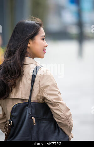 Picture of One beautiful young Chinese woman outdoor in the street Stock Photo