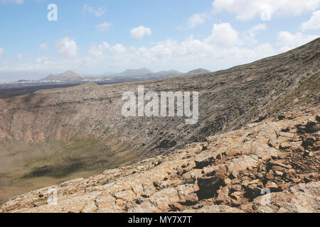 Caldera Blanca seen from the crater rim on the island of Lanzarote. Stock Photo