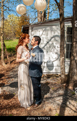 Newly married millennial couple has first dance Stock Photo