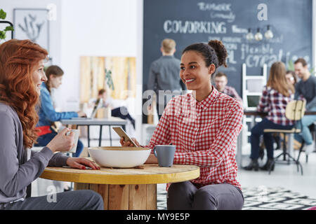 Happy workers of creative agency having coffee break Stock Photo