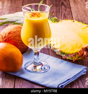 Tropical milkshake with ingredients, selective focus. Stock Photo