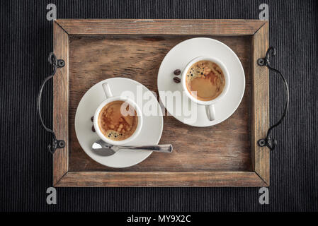 Coffee Espresso. Two Cup Of Coffee on wooden tray,  top view Stock Photo