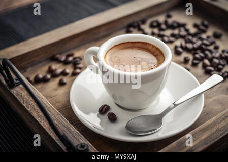 Coffee Espresso.Cup Of Coffee on wooden background closeup. Stock Photo