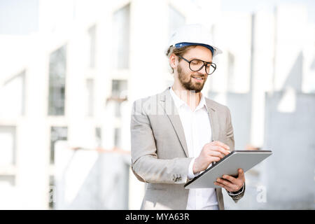 Engineer with tablet on the structure Stock Photo