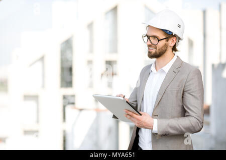 Engineer with tablet on the structure Stock Photo