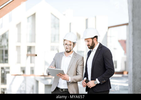 Engineers with tablet on the structure Stock Photo