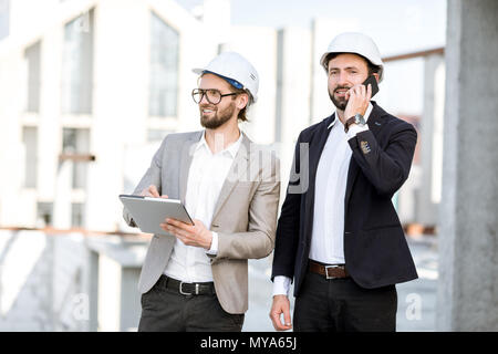 Engineers with tablet on the structure Stock Photo