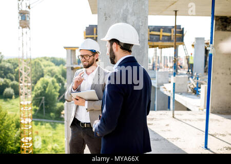 Supervising the process of house construction Stock Photo
