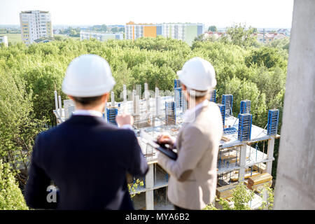 Supervising the process of house construction Stock Photo