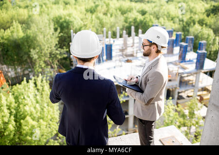 Supervising the process of house construction Stock Photo