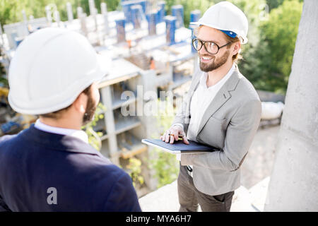 Supervising the process of house construction Stock Photo