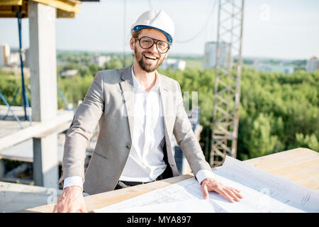 Engineer with drawings on the structure Stock Photo
